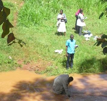 Students measuring river discharge in Thiririka River, in Kiambu County as part of AGE 867 Watershed Evaluation